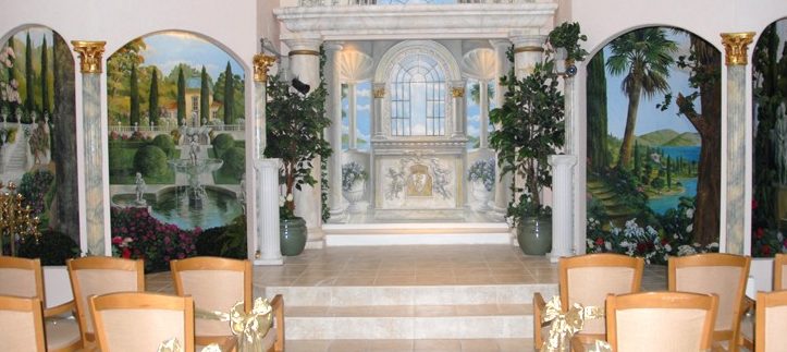 The altar of the Princess Wedding Chapel with painted garden murals
